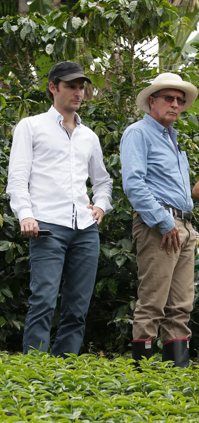 Santiago and his father in the coffee seedling nursery